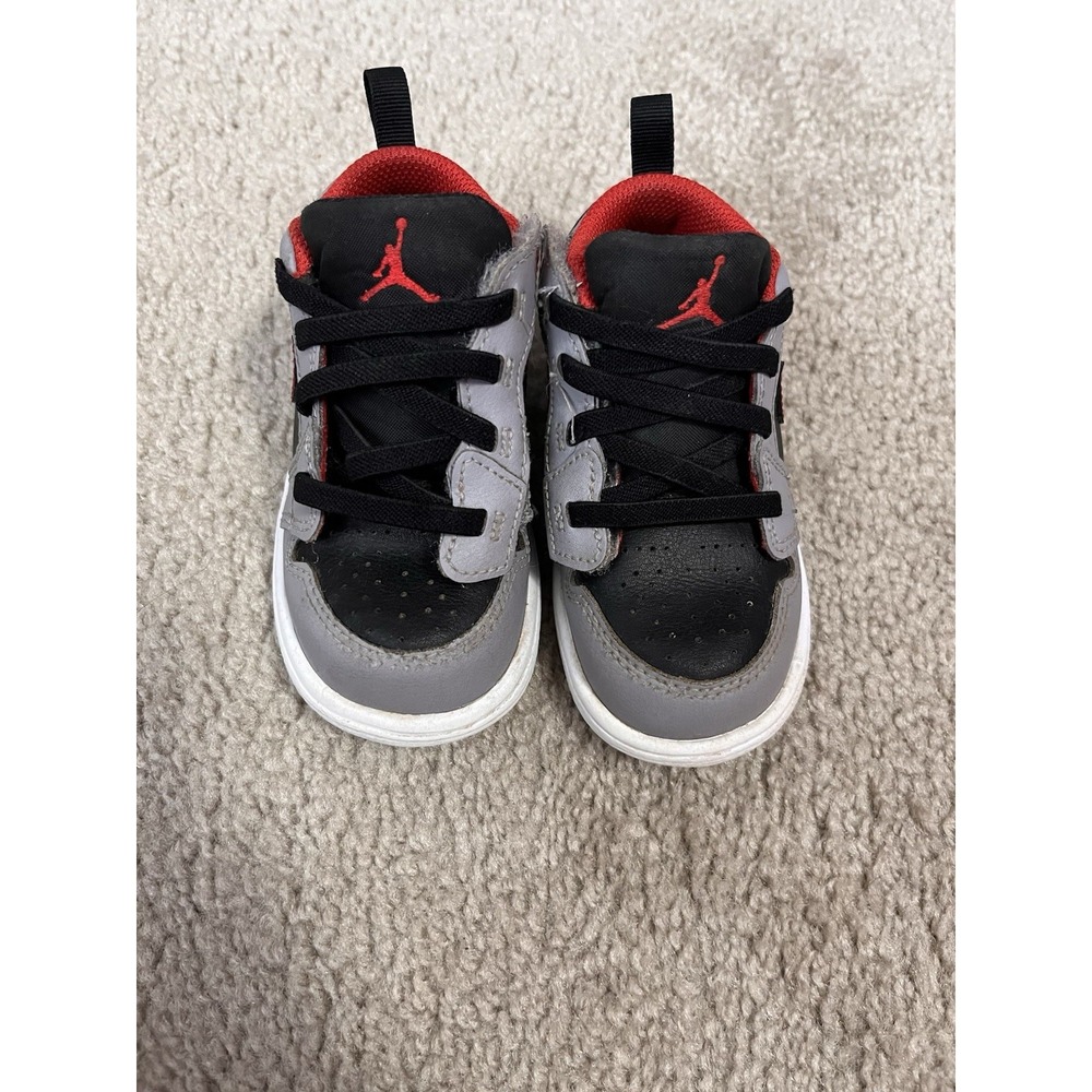 Air Jordan 1 Low Alt sneakers in a black, cement grey, and red colorway